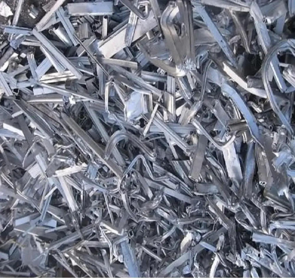 Aluminium extrusions frames and sheet stacked for scrap pickup