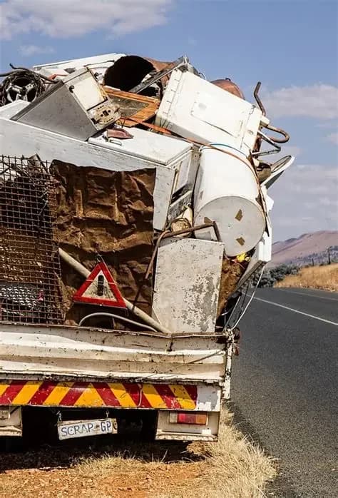 Radiator battery motor and mixed recyclable metal in a scrap bin
